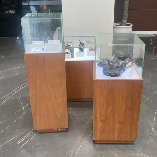 Glass display stand with wood base for BMW Auto Shop