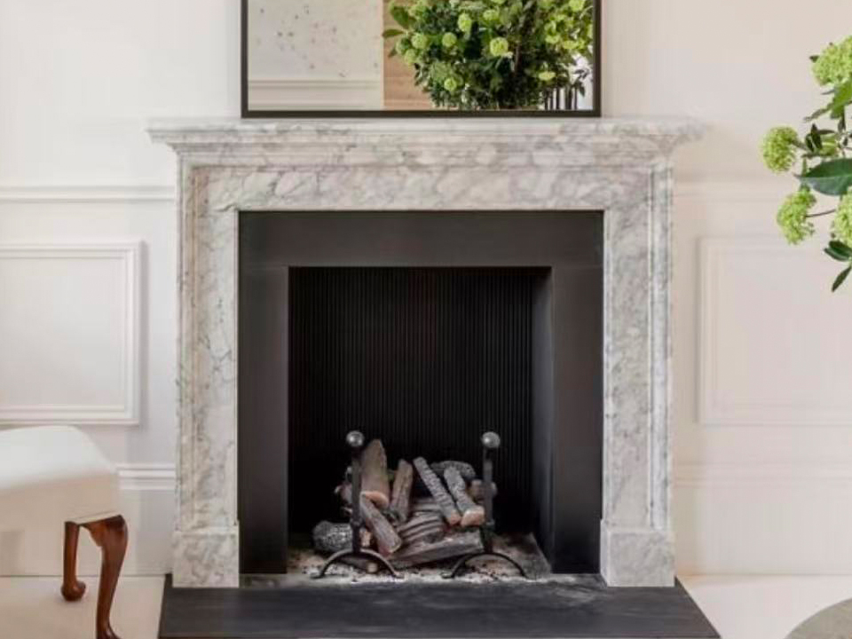 Fireplace sculpted from Bianco Carrara marble