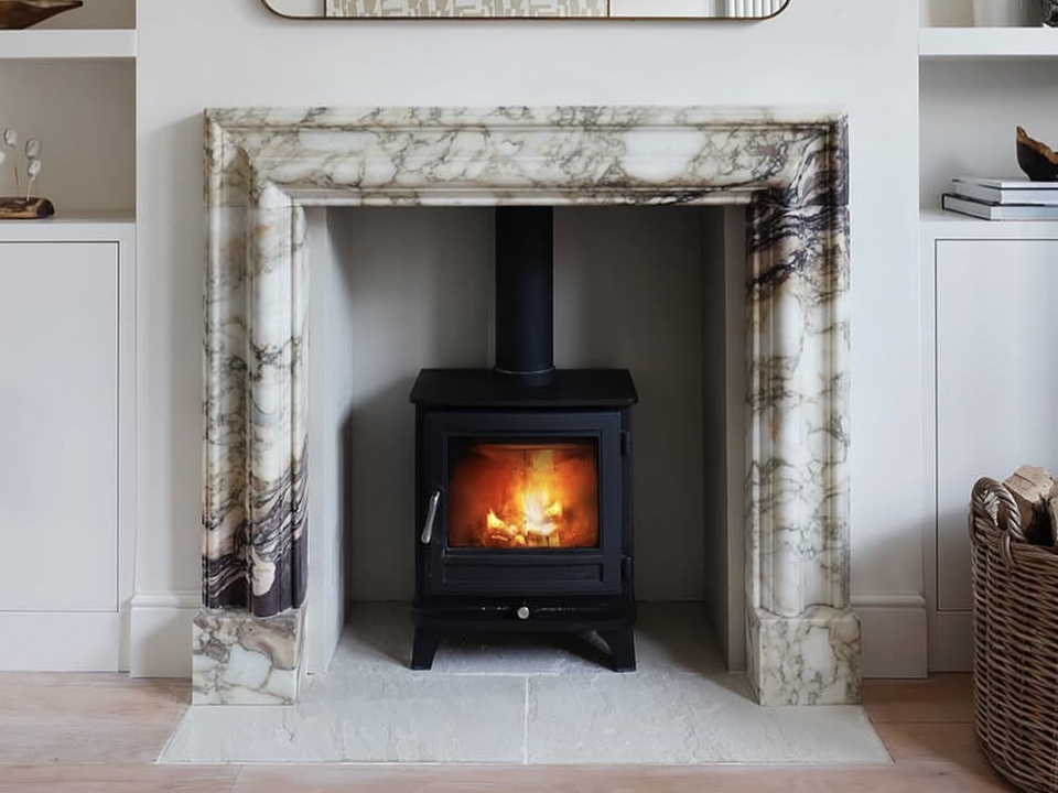 Marble fireplace mantel for wood burning stove