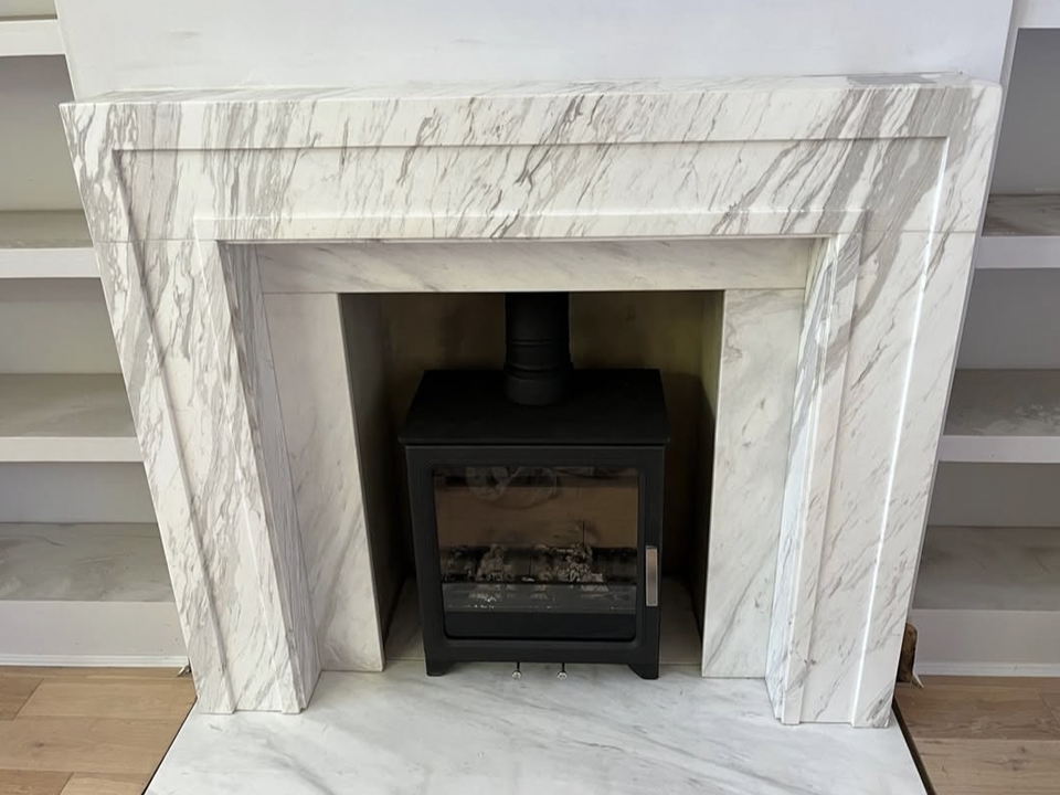Volakas marble surround with distintive white and greyish veining