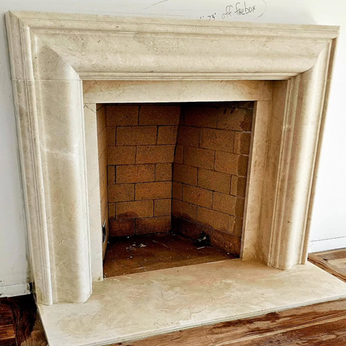Crema Marfil marble bolection fireplace mantel