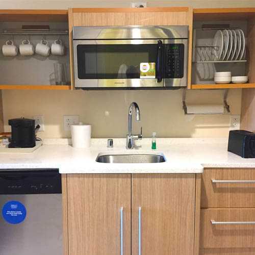Hotel kitchenette cabinet with storage